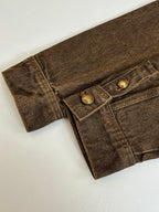 Louis Vuitton brown denim jacket close-up of cuff and two-button pocket flap