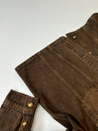Louis Vuitton brown denim jacket close-up of side seams and chest pocket buttons