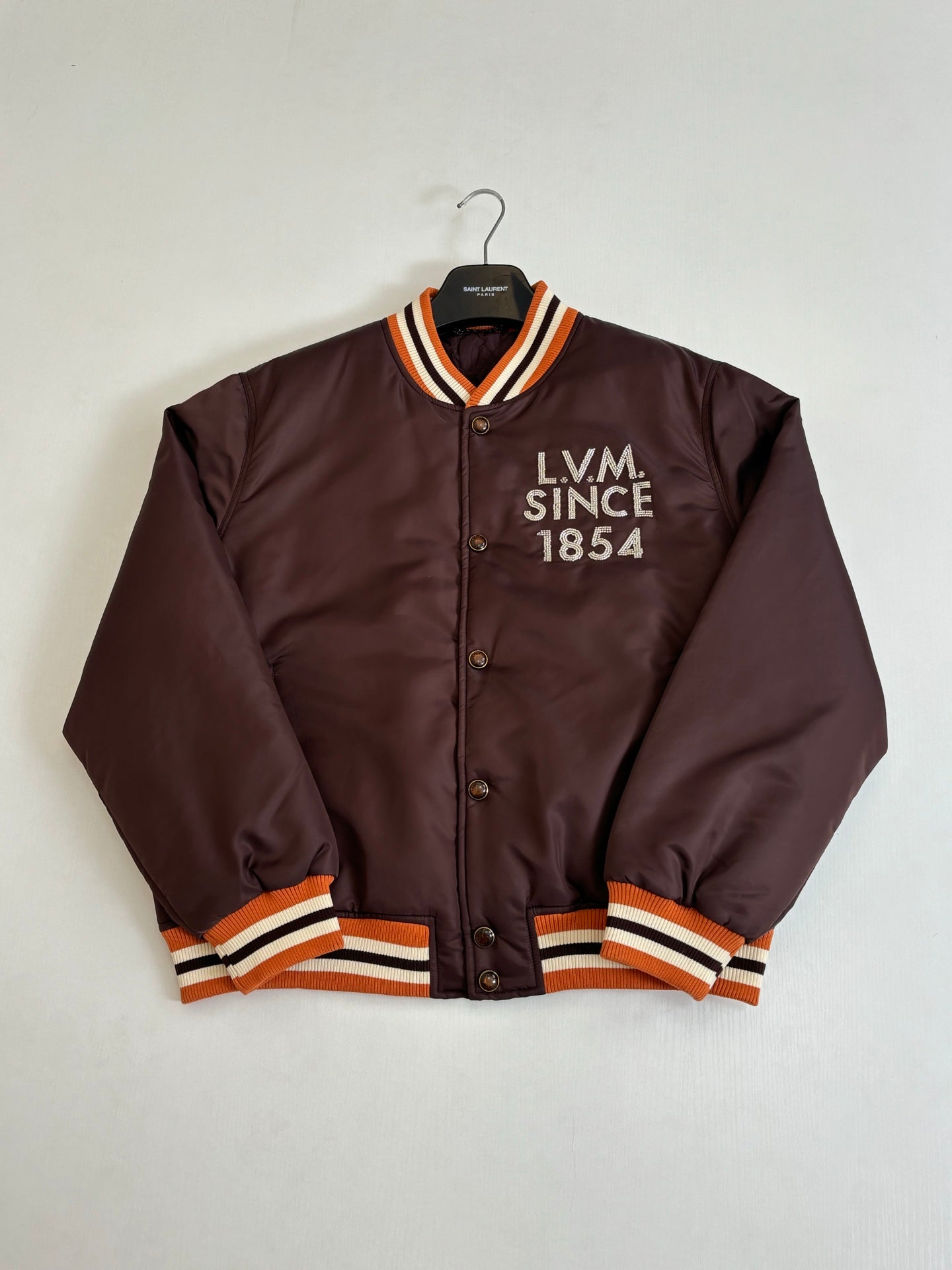 Louis Vuitton long bomber jacket, front view dark brown with orange-striped rib trims