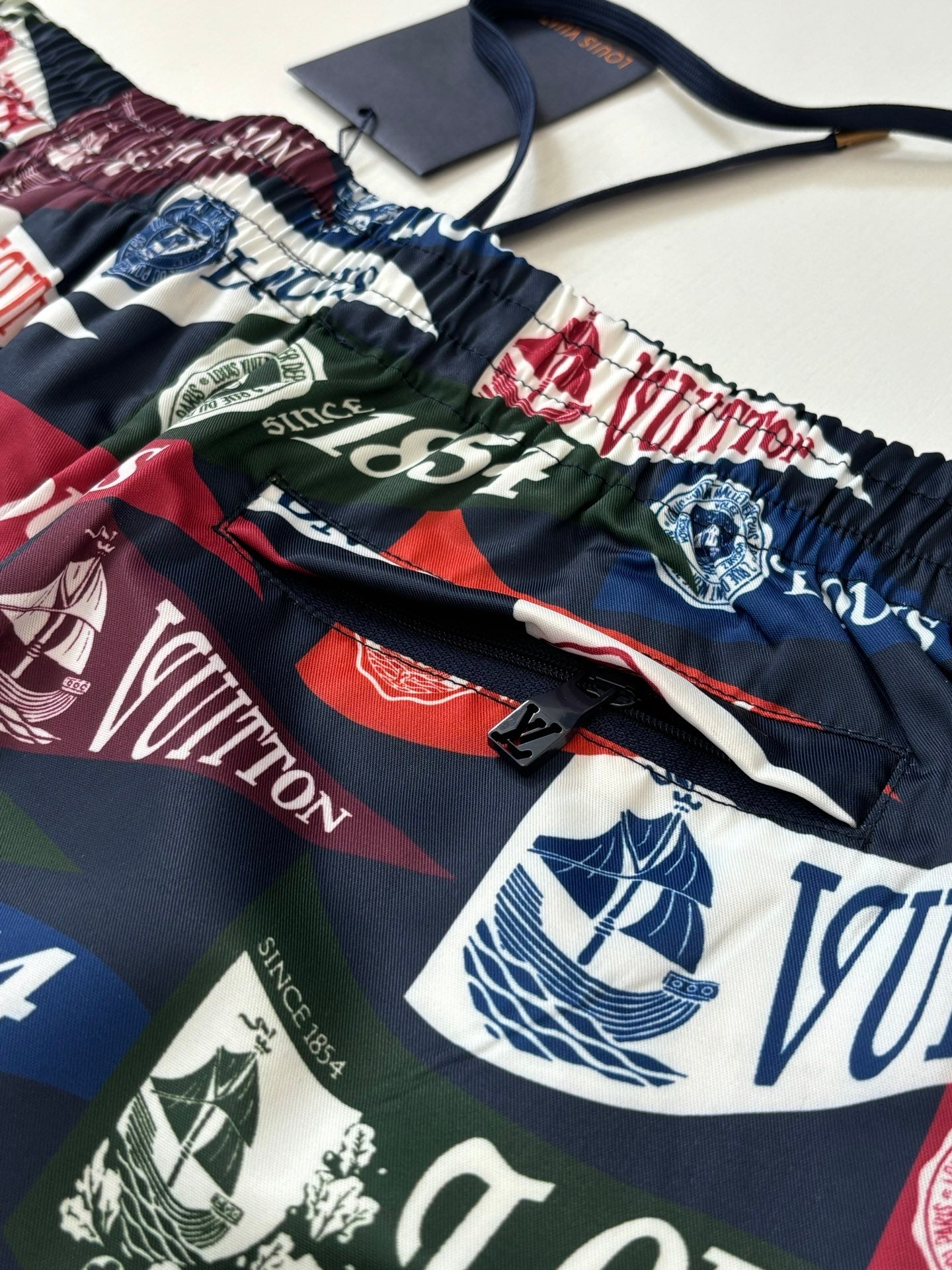Louis Vuitton logo-print shorts waistband with black drawstring and gathered elastic