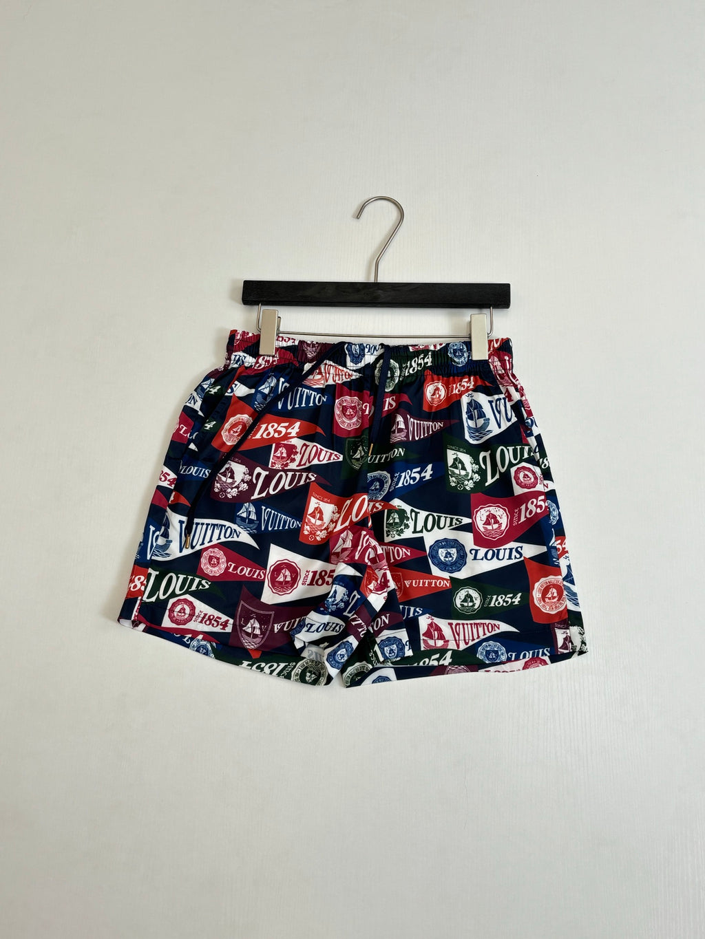 Louis Vuitton logo-print shorts with elastic waist and multicolor pattern on hanger