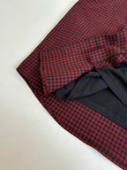 Balenciaga long-sleeve shirt sleeve detail; red check fabric over black wrap section