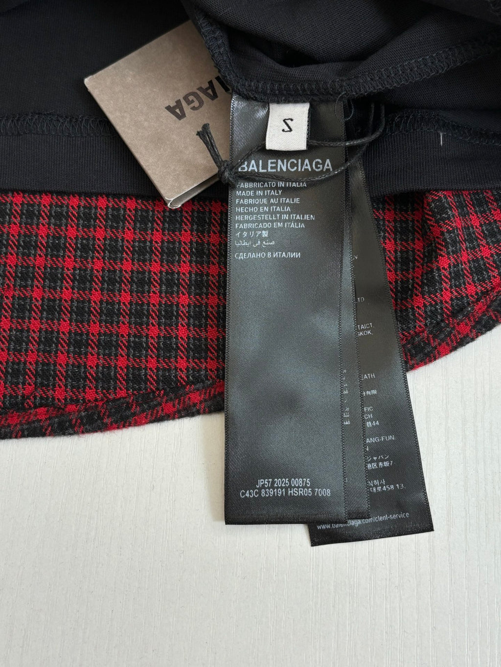 Balenciaga long plaid coat in red and black with attached size tag