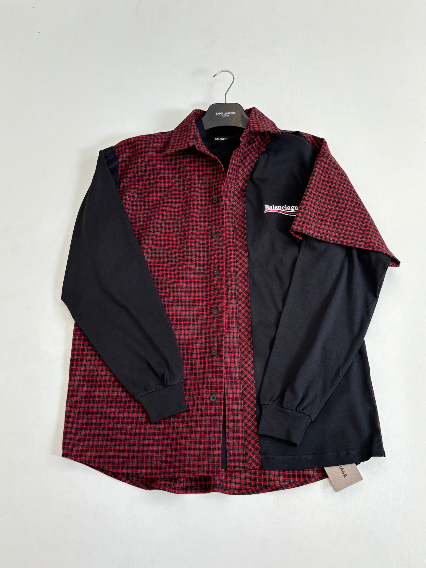 Balenciaga long-sleeve shirt front view; red check panel with black sleeves and buttons