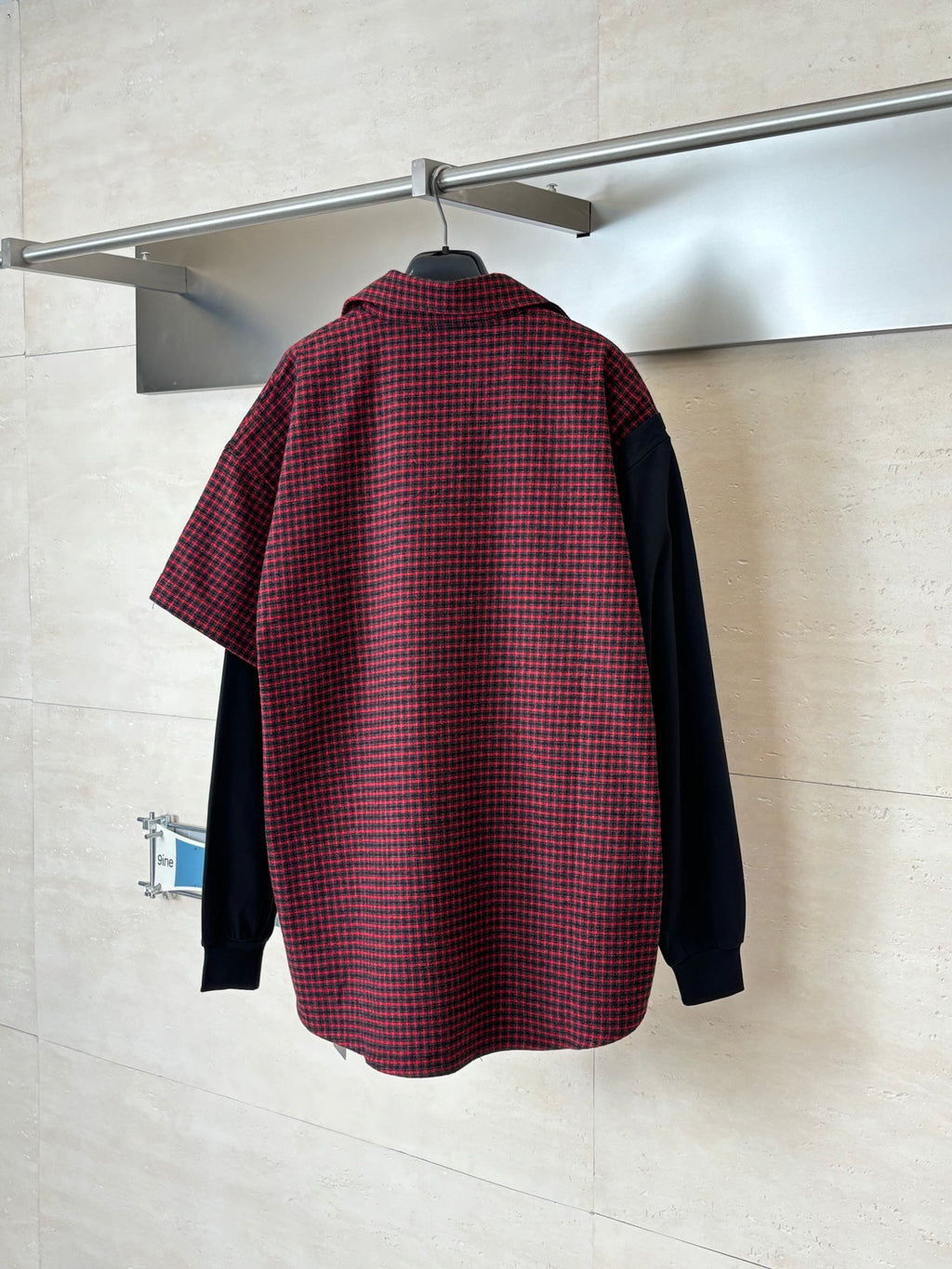 Balenciaga long-sleeve shirt back view with red-and-black check body and black sides