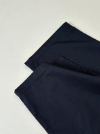 Gucci navy pants folded back view with waistband and seam detail