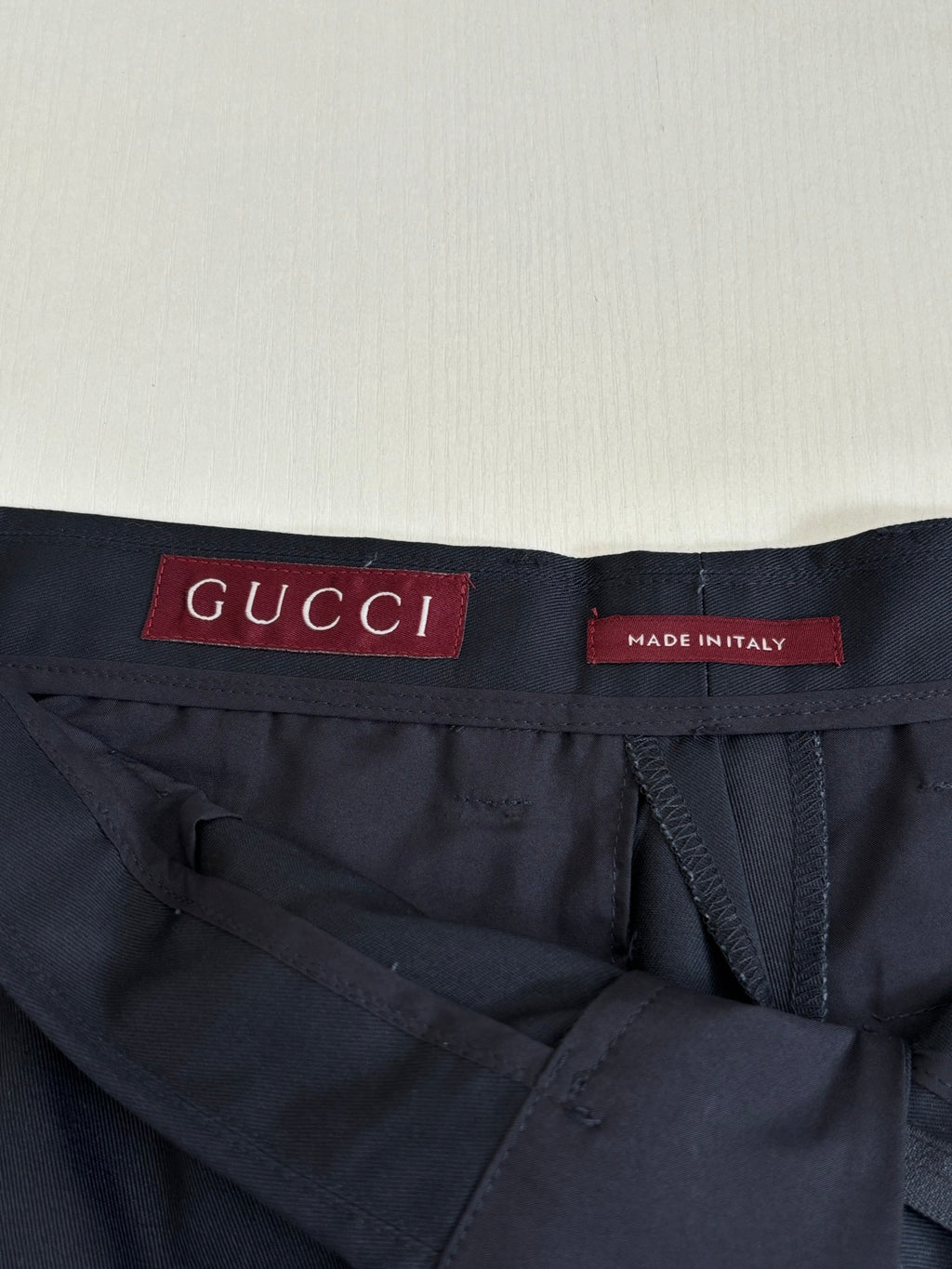 Gucci navy pants interior waistband with Gucci label and made in Italy tag