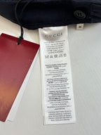 Gucci pants care label and size tag on inner waistband