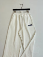 White drawstring pants with elastic waist and Balenciaga logo patch