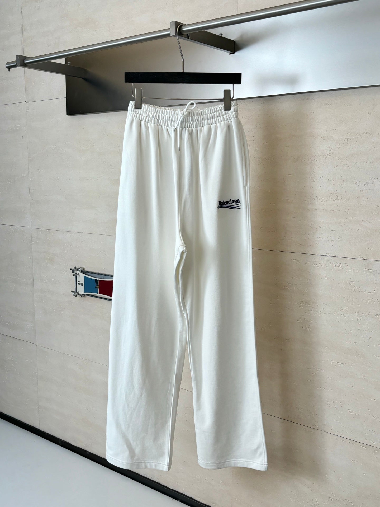 White wide-leg drawstring pants with elastic waistband