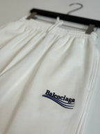 White drawstring pants with elastic waist and Balenciaga logo embroidery