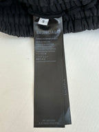 Balenciaga pants size and care tag on black fabric waistband