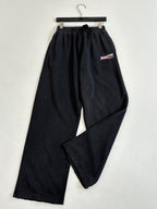 Black Balenciaga track pants, elastic waist and side logo patch