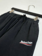 Black Balenciaga pants, drawstring waistband with Balenciaga logo patch