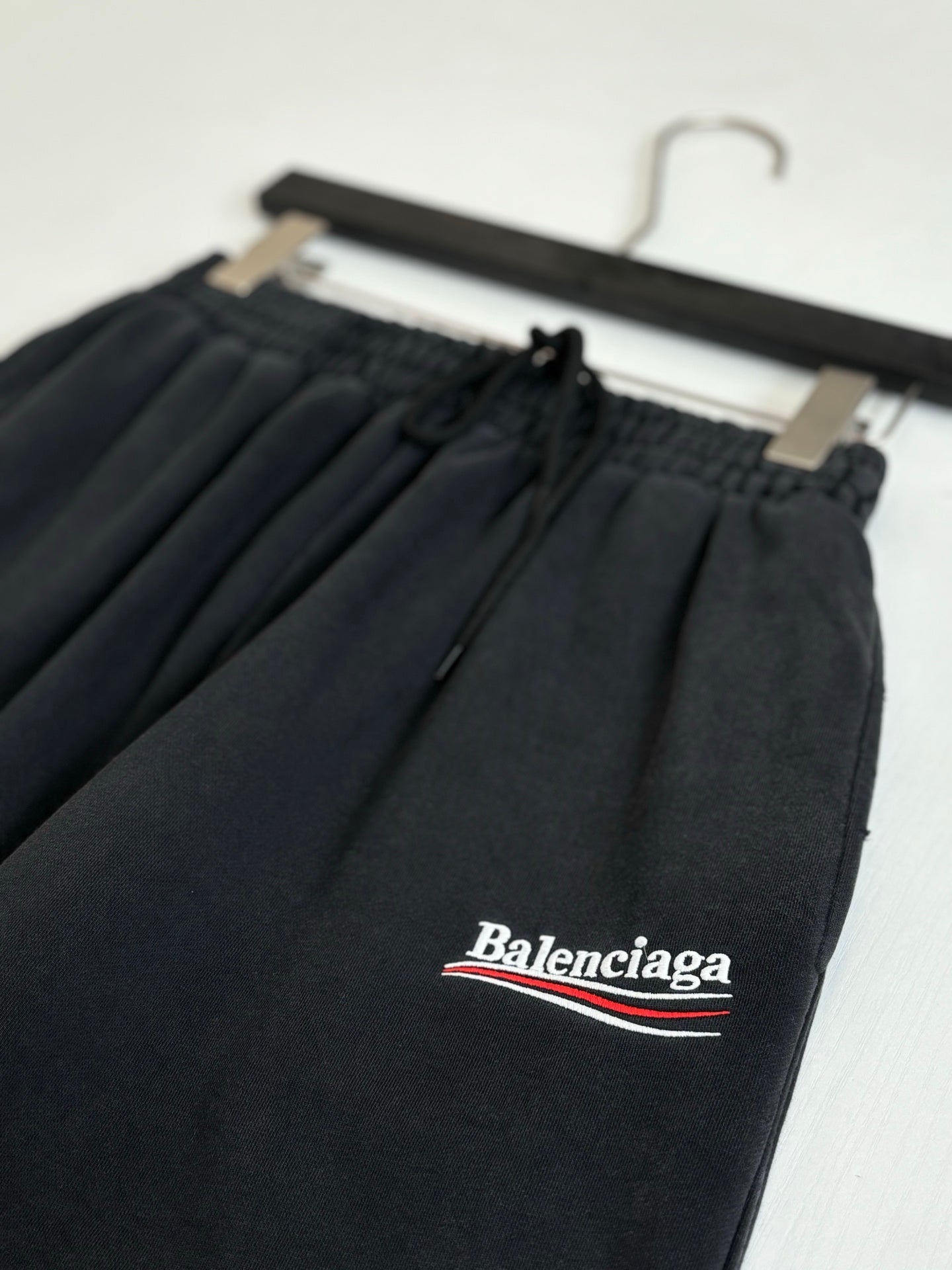 Black Balenciaga pants, drawstring waistband with Balenciaga logo patch