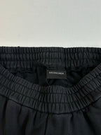 Black track pants with gathered elastic waistband and Balenciaga size label inside