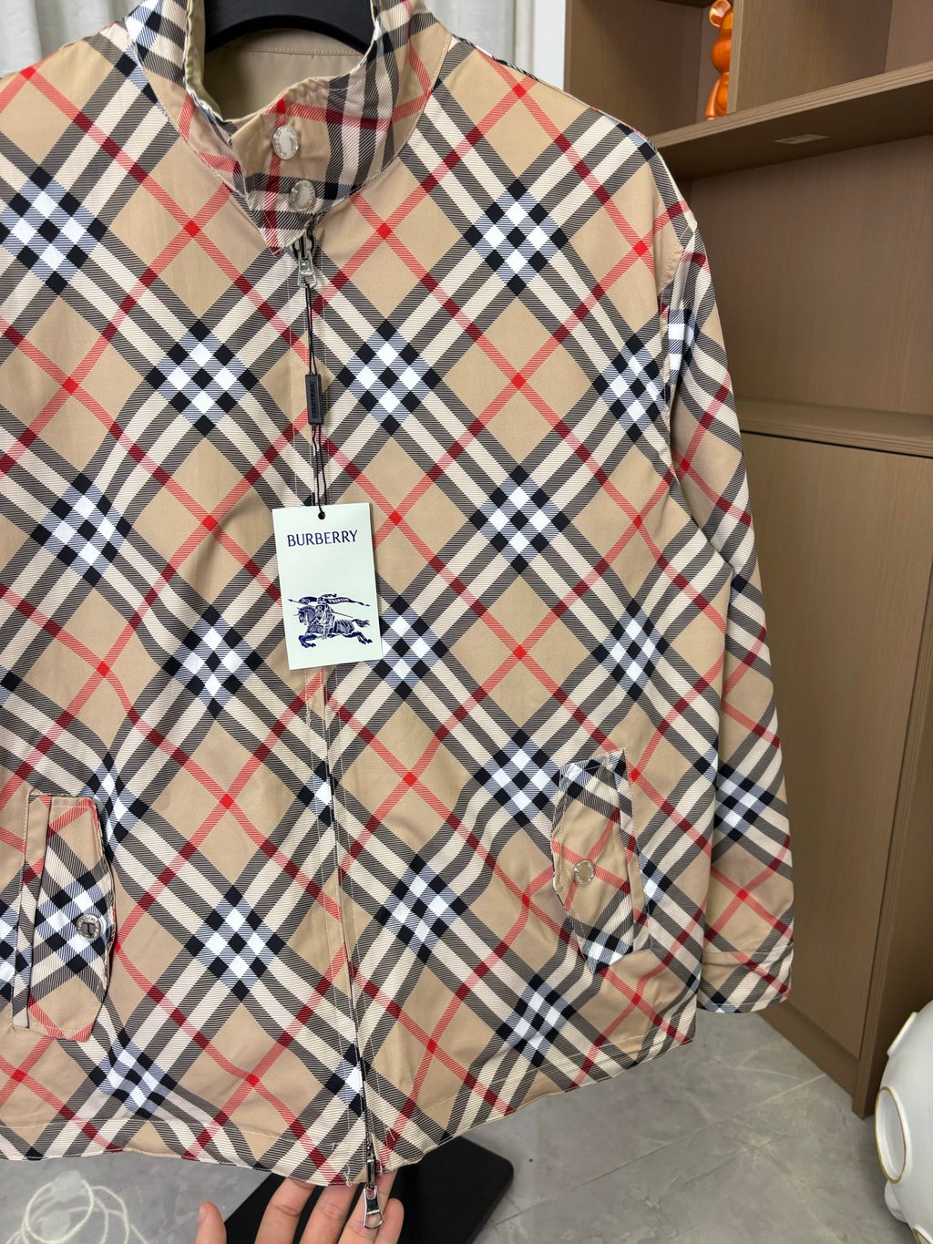 Burberry long jacket, beige plaid, close-up of zip front and inner plaid stand collar