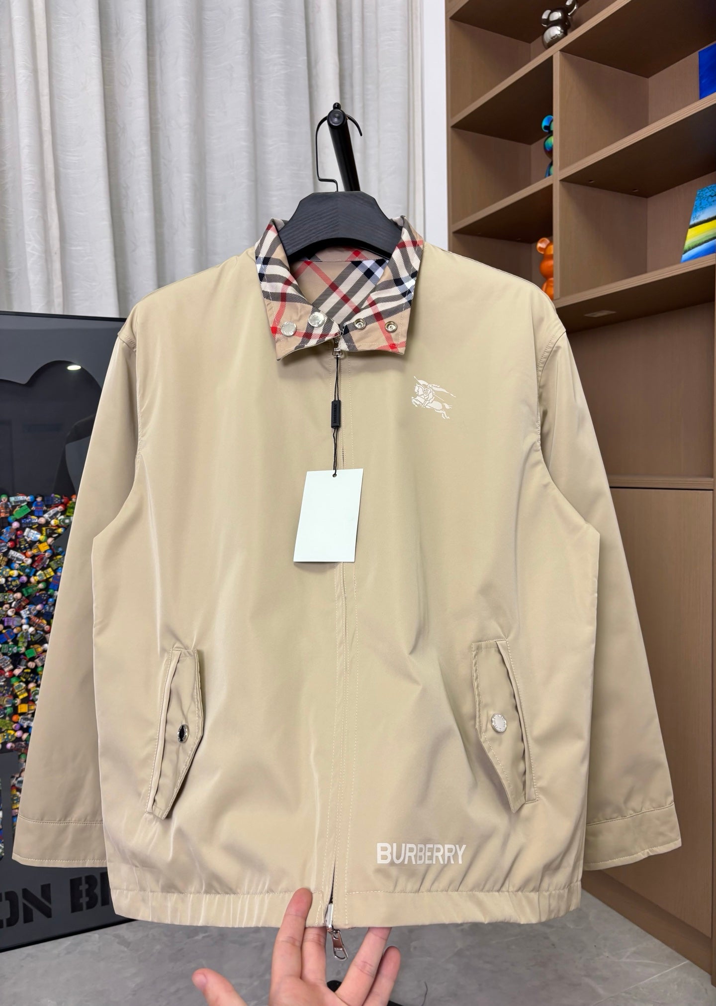 Burberry long jacket, pale yellow, front view with stand collar and zip placket