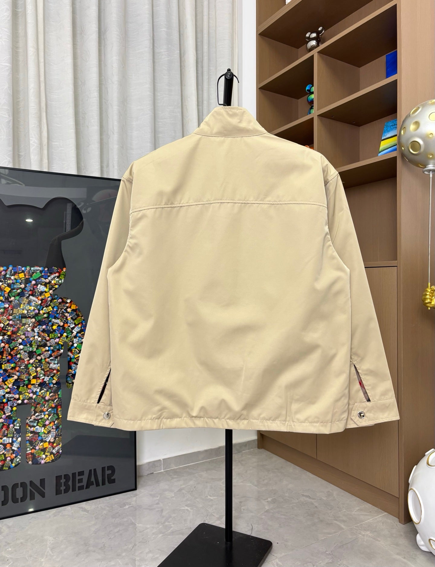 Burberry long jacket, pale yellow, back view with long sleeves and hem side tabs