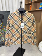 Burberry plaid hooded zip jacket, front view with chest pocket and logo tag