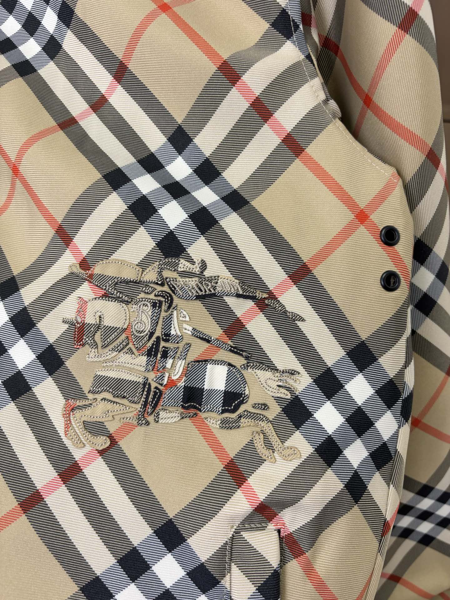 Burberry long jacket plaid chest panel with decorative embroidery and black buttons