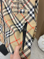 Burberry long jacket plaid front with black zipper and embroidered crest