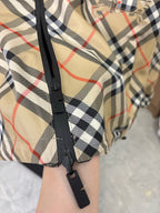 Burberry long jacket plaid hood with black snap placket and strap details