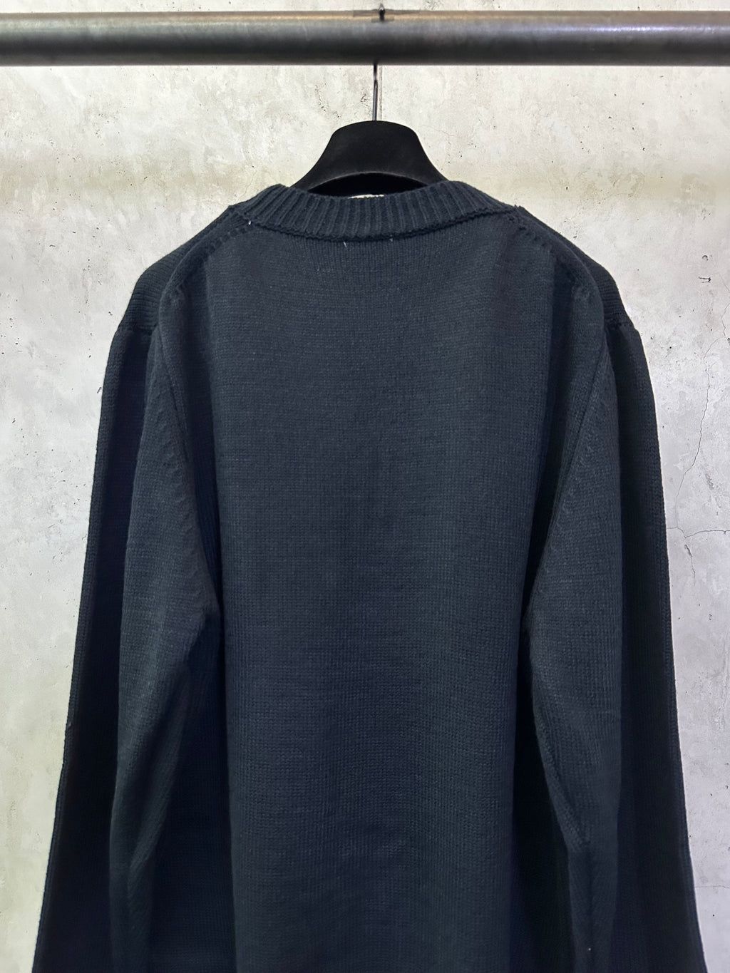 Burberry knit sweater back view with crew neck and smooth dark knit body