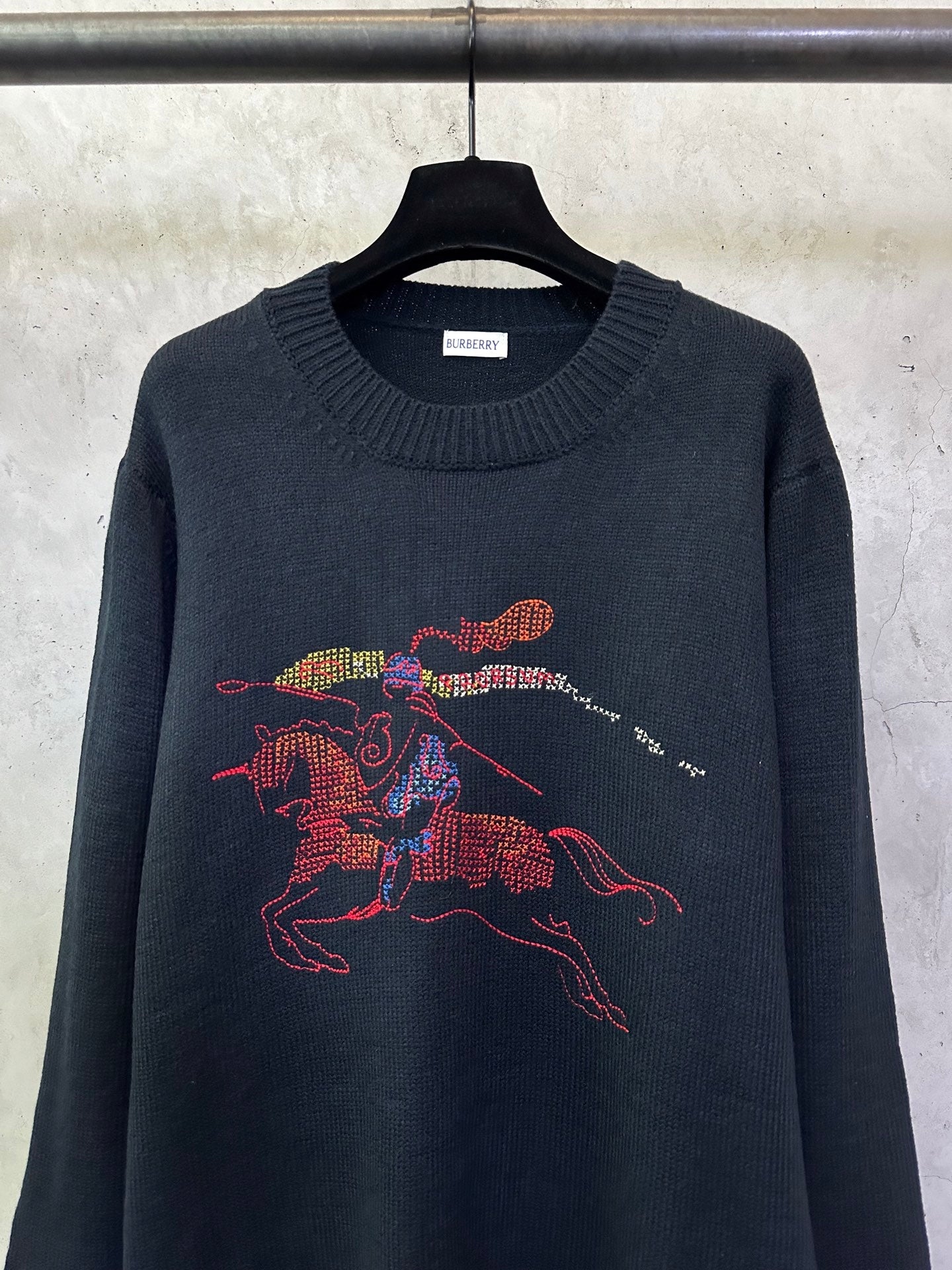 Burberry knit sweater with colorful horse graphic and crew neckline in dark knit