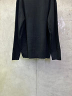 Dark navy knit sweater back view with ribbed hem and long sleeves
