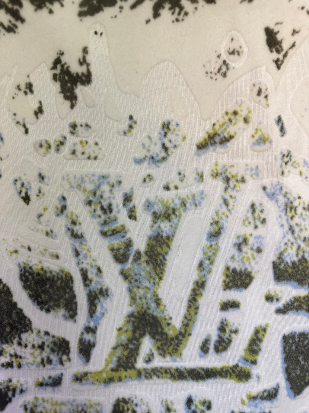Colorful graphic print on white T-shirt fabric