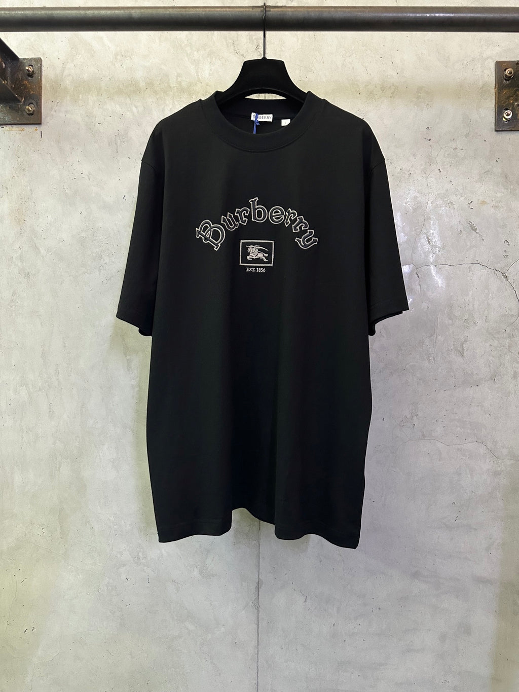 Black crewneck short-sleeve T-shirt with Burberry logo graphic on chest