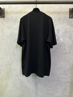 Black crewneck short-sleeve T-shirt, back view with curved hem