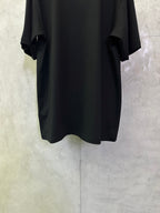 Black crewneck short-sleeve T-shirt, back view with wide sleeves