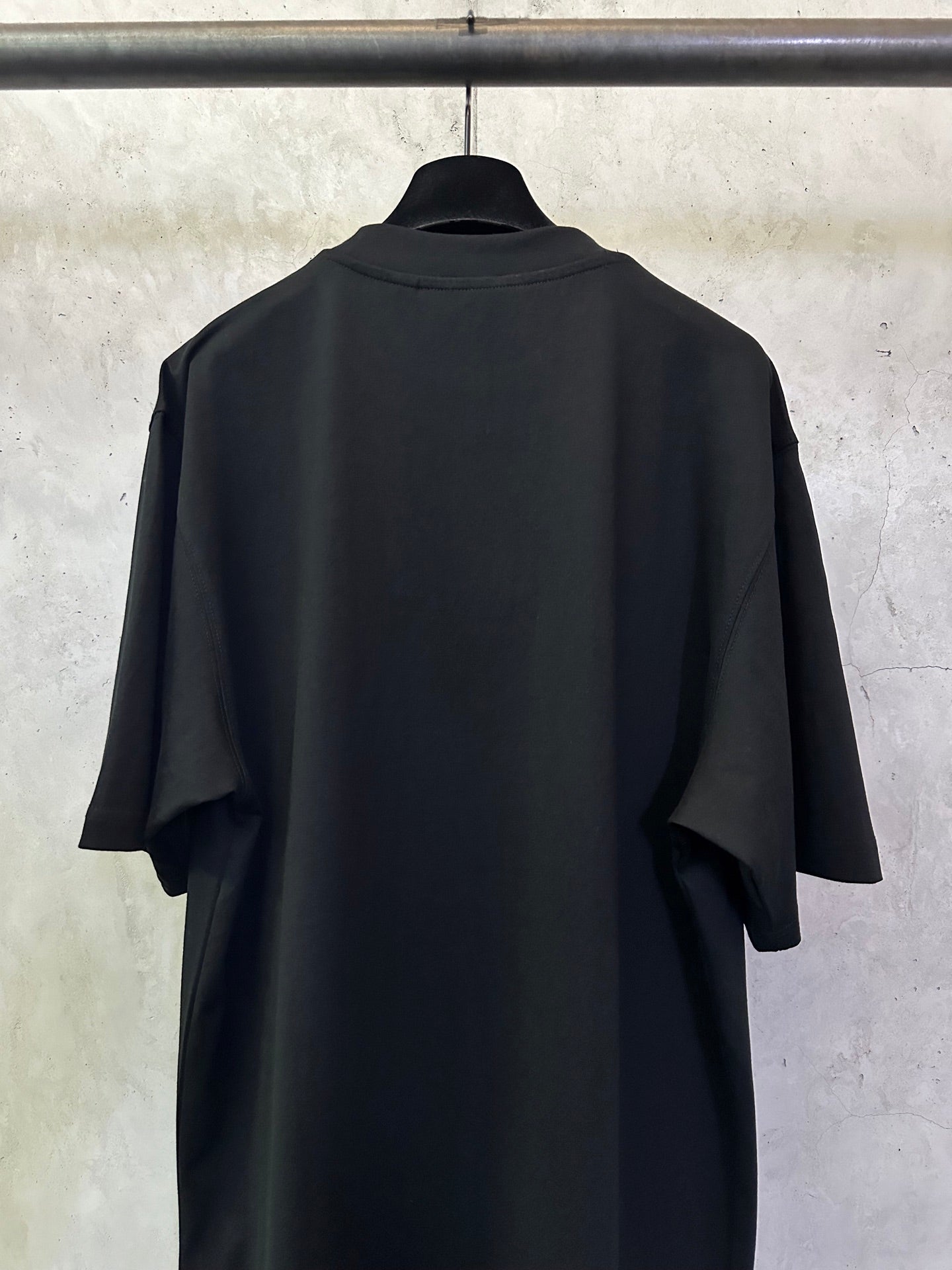 Black crewneck short-sleeve T-shirt, back view