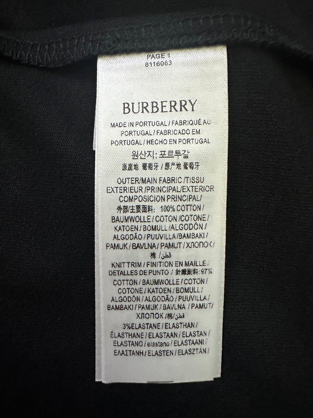 White Burberry fabric care label with product and material details