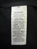 White Burberry fabric care label with product and material details
