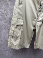 Light beige cargo shorts leg with snap button flap pocket