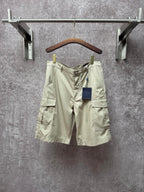 Light beige cargo shorts, button front and flap side pockets