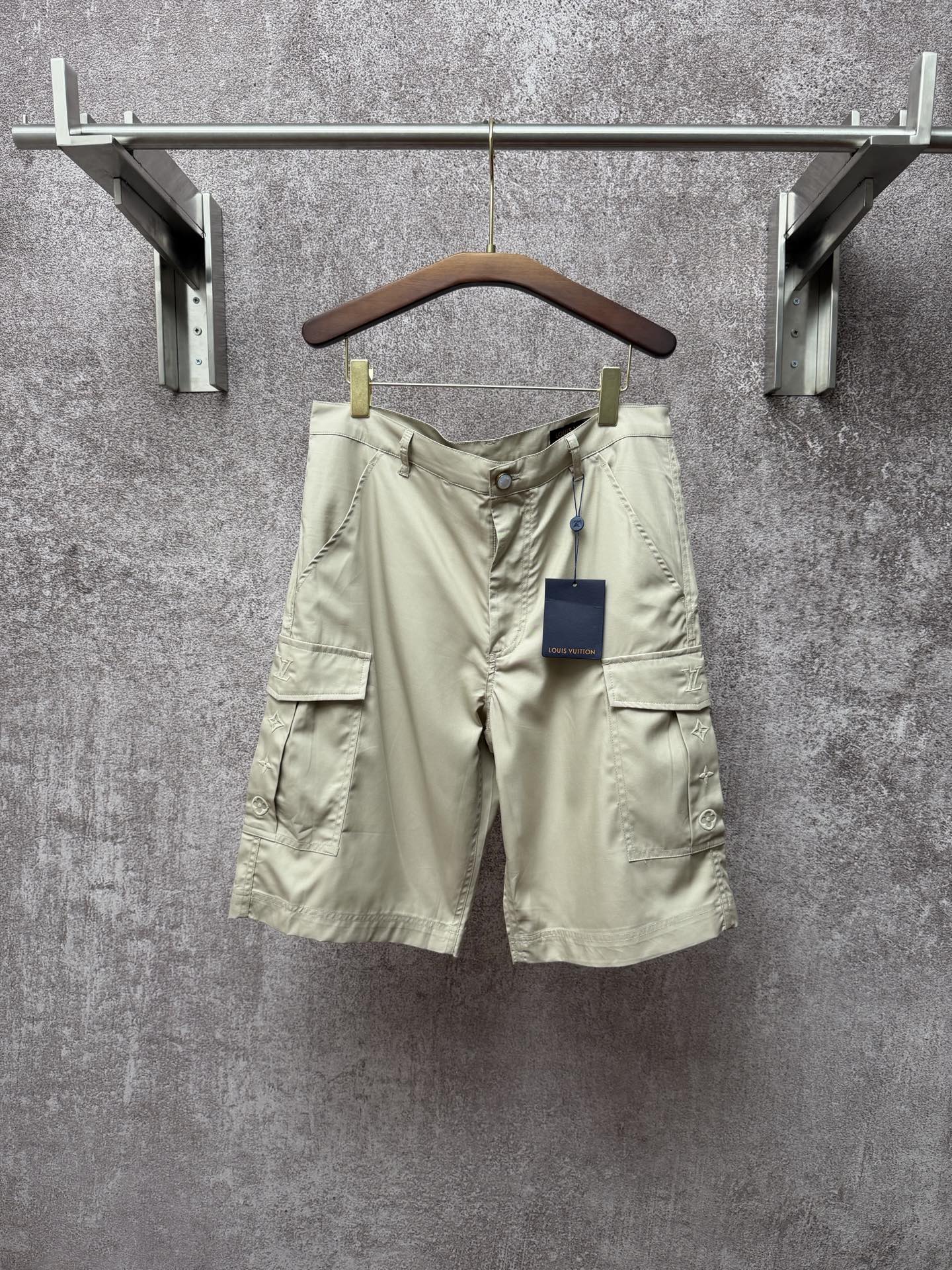 Light beige cargo shorts, button front and flap side pockets