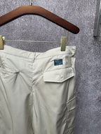 Light beige cargo shorts with rear patch pockets and belt loops