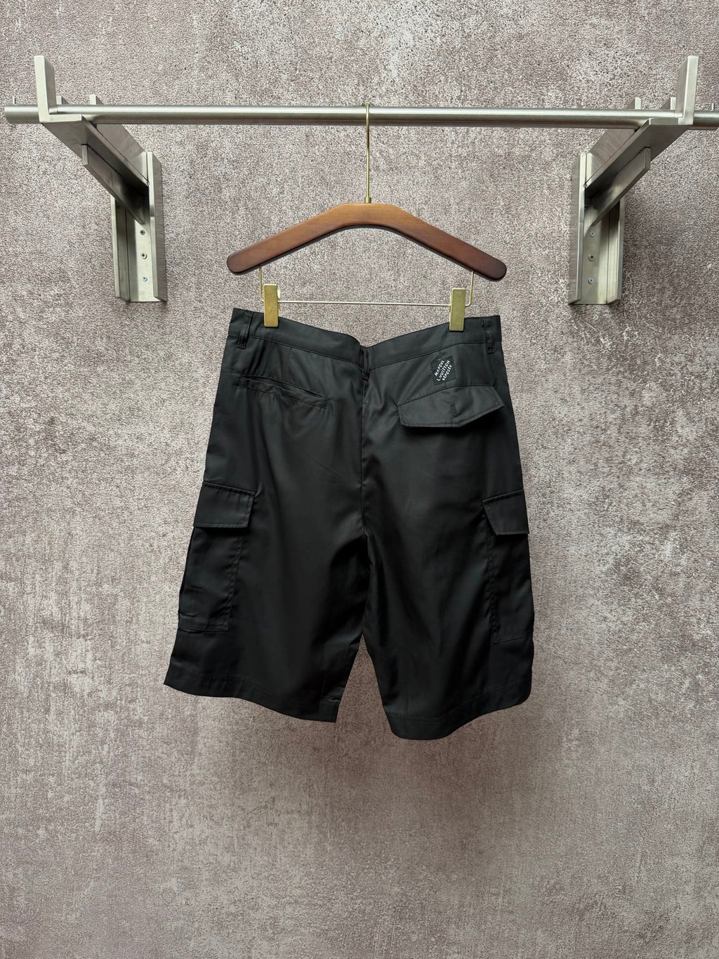 Dark cargo shorts with pleated front and flap cargo pocket, Louis Vuitton logo