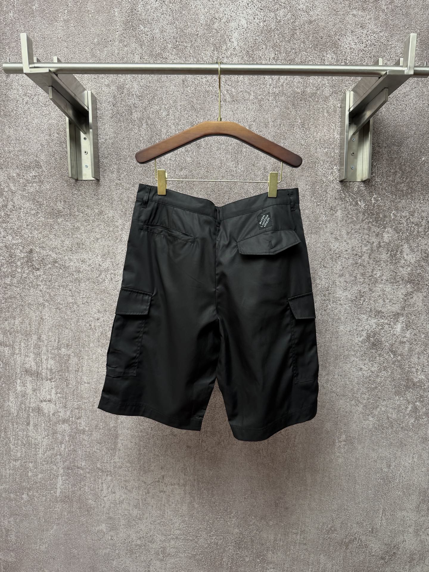 Dark cargo shorts with pleated front and flap cargo pocket, Louis Vuitton logo