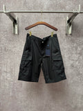Black cargo shorts with cargo pockets and Louis Vuitton logo patch
