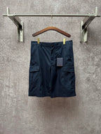 Dark blue cargo shorts with front zipper, belt loops, and two flap side pockets