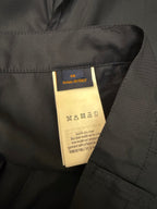 Louis Vuitton care label inside dark blue shorts, marked Made in Italy