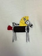 Embroidered Dior graphic on white T-shirt: black and yellow character