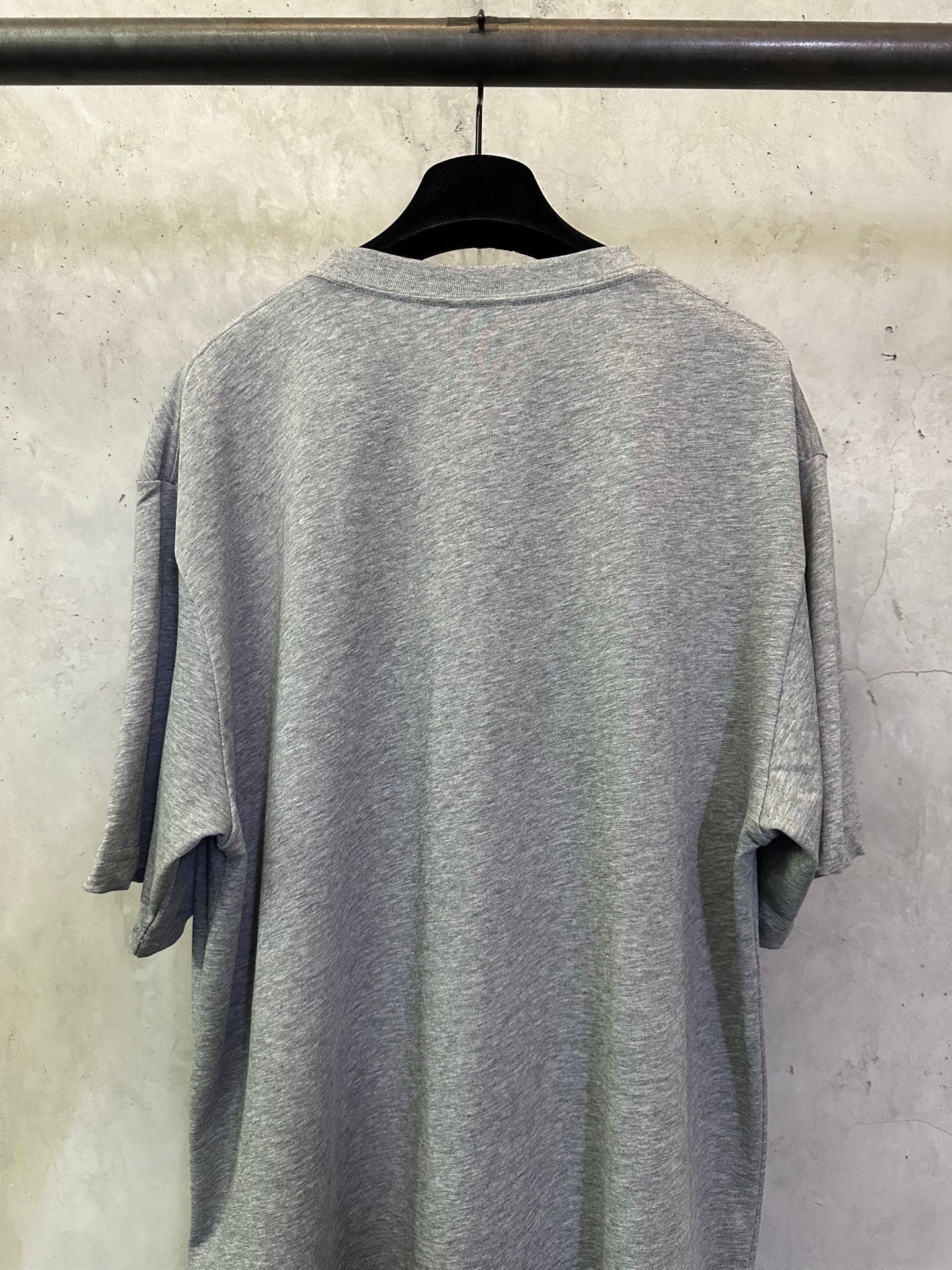 Heather gray short-sleeve T-shirt, back view on hanger