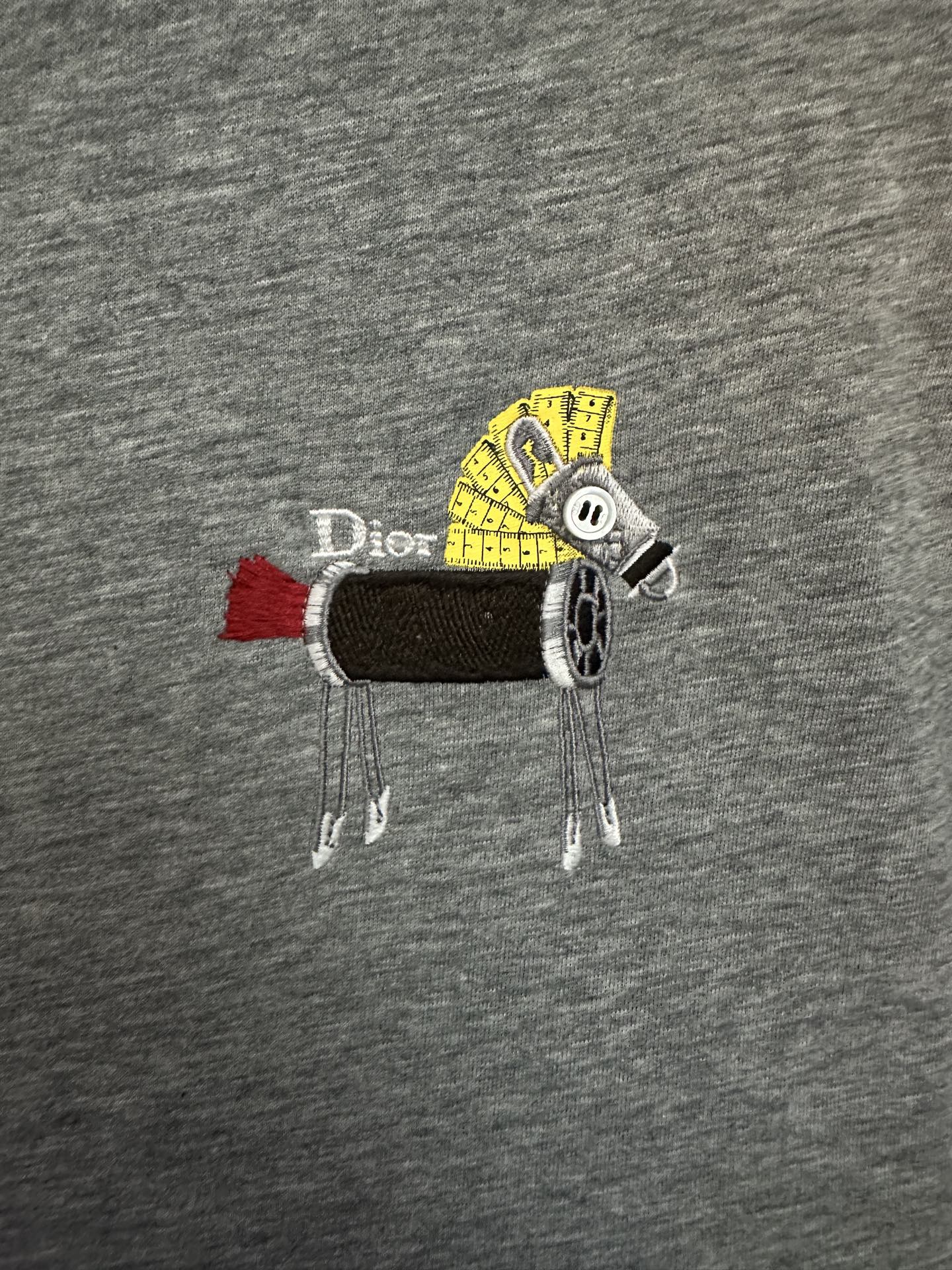 Heather gray T-shirt with colorful animal graphic patch across chest