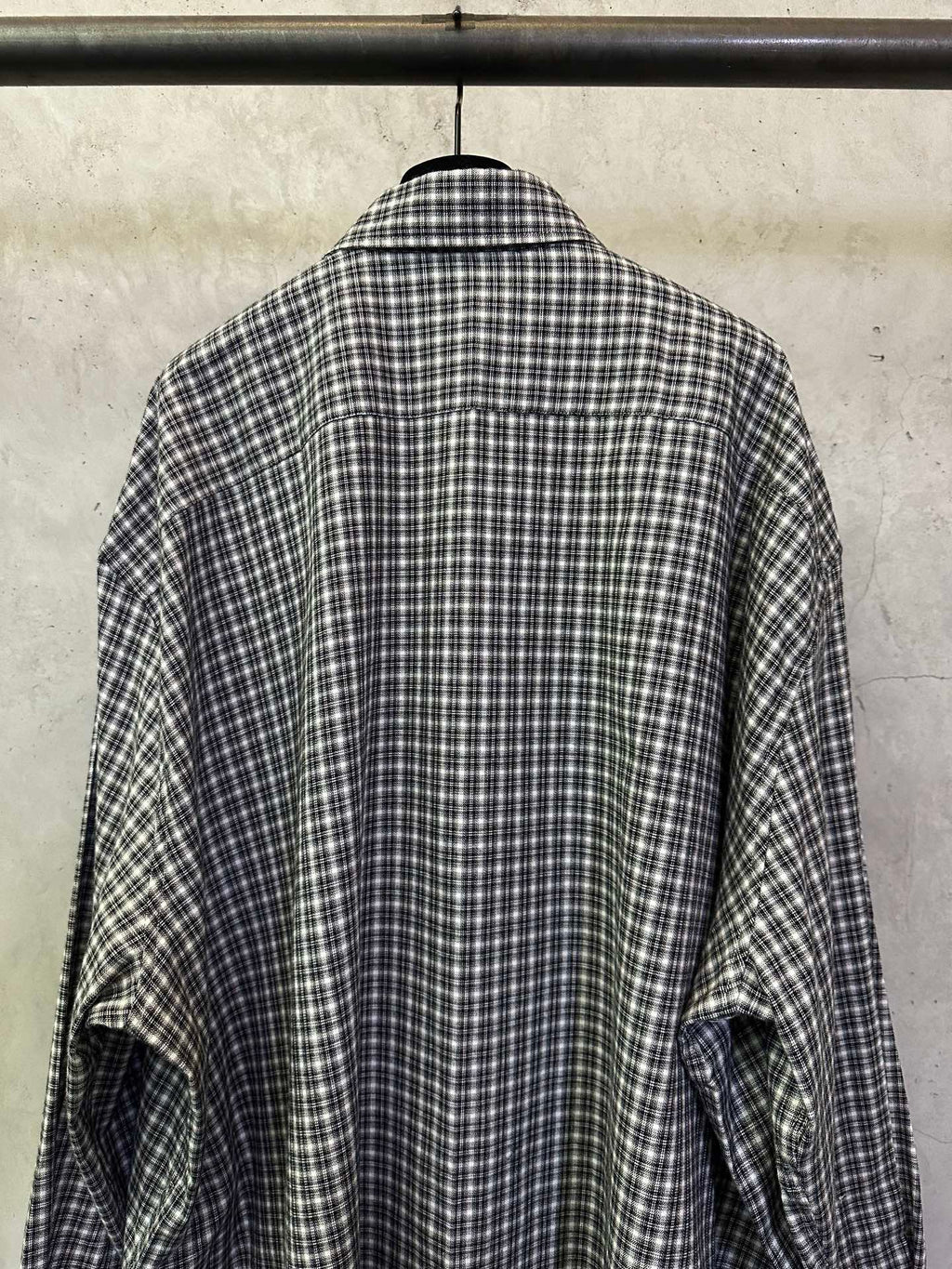 Balenciaga long plaid long-sleeve shirt, back view with rounded hem